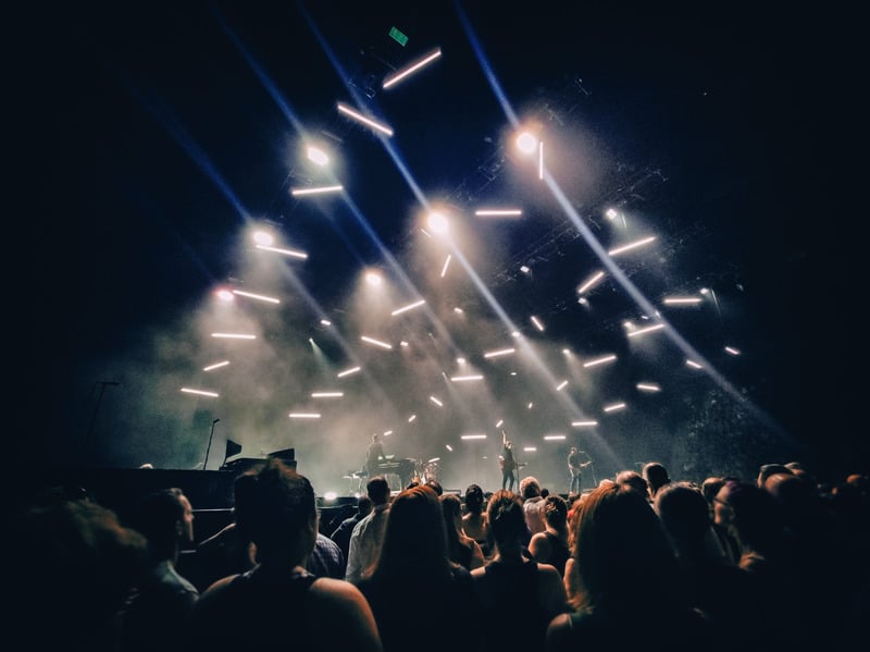 Confetti and lights over a Bold Music concert crowd